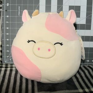 Squishmallow Caedyn the cow, light pink eyes closed